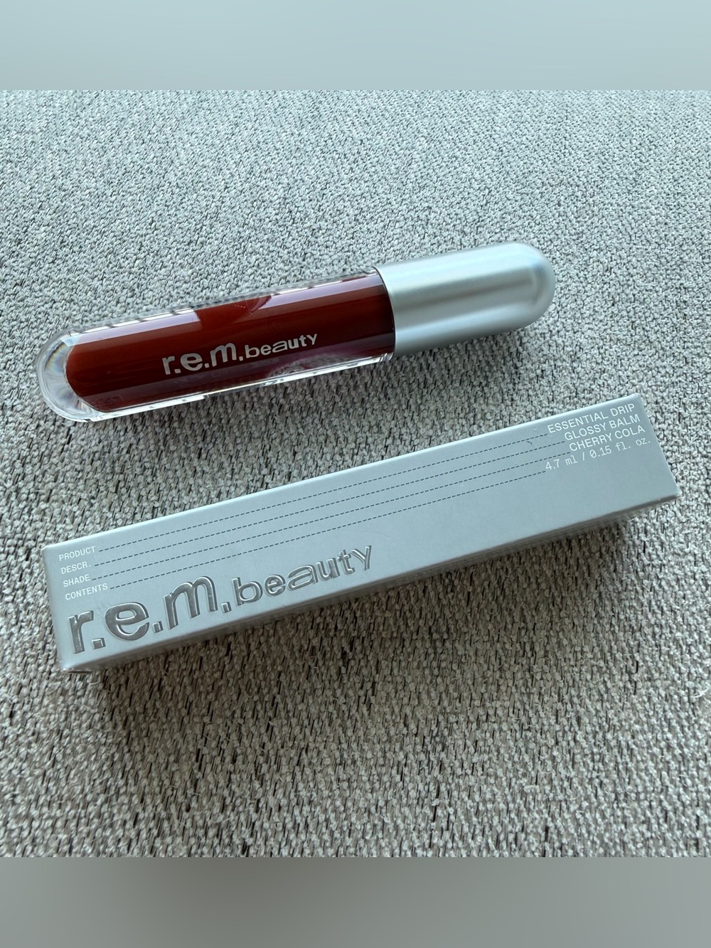 R.E.M. Beauty Essential Drip Glossy Balm in Cherry Cola
